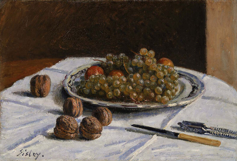 Grapes and Walnuts on a Table scale comparison